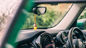 designer inspired car air freshener in orange bottle
