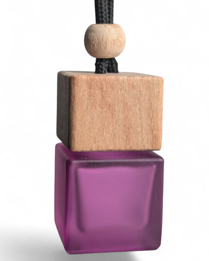Alien-inspired hanging car air freshener in matte purple square glass bottle, handmade by Castle of Scents UK"