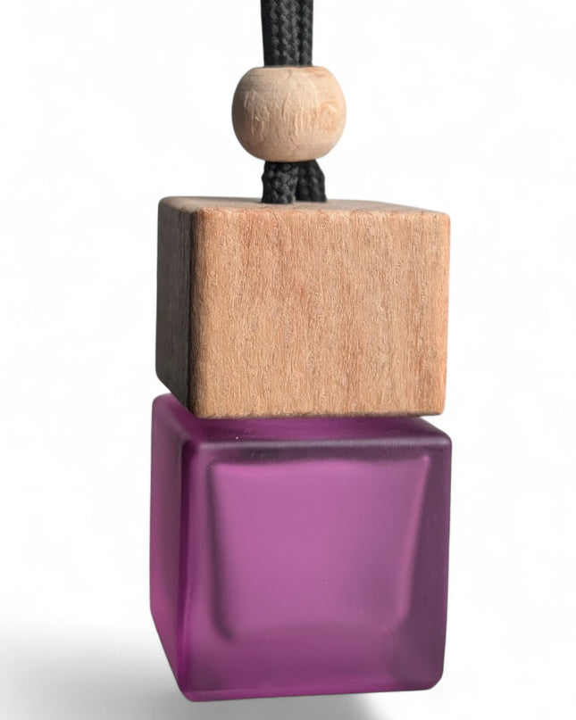 Alien-inspired hanging car air freshener in matte purple square glass bottle, handmade by Castle of Scents UK"